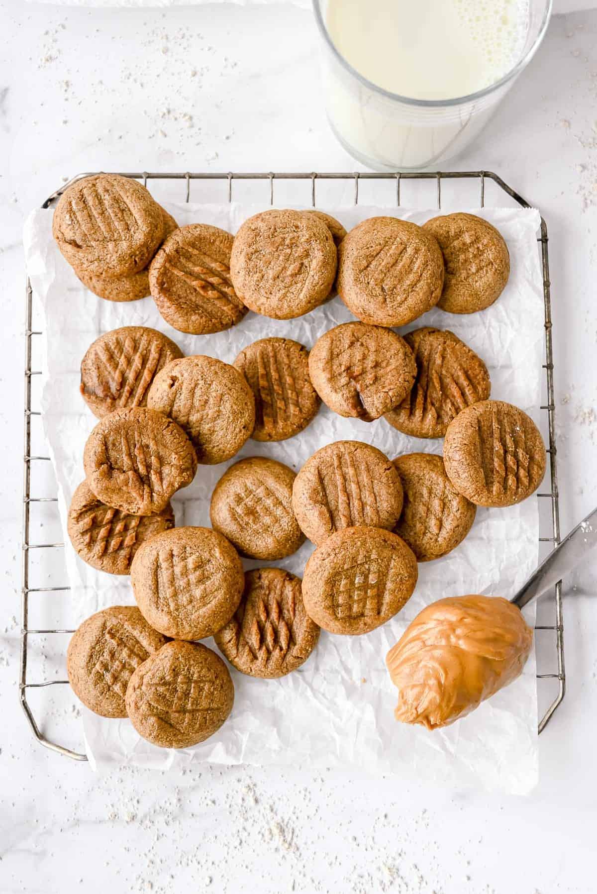 healthy peanut butter cookies on a cooling rack.