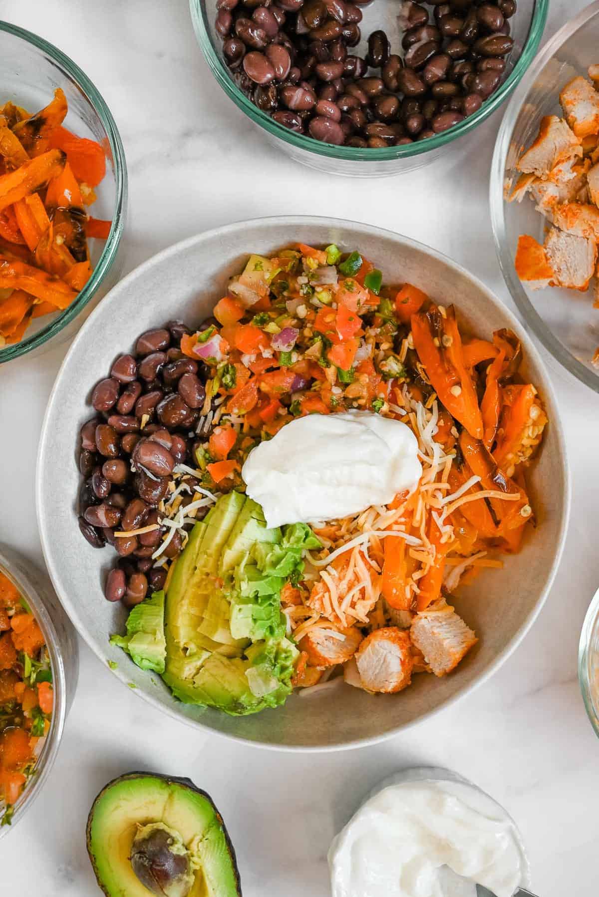 healthy burrito bowl in a white bowl 