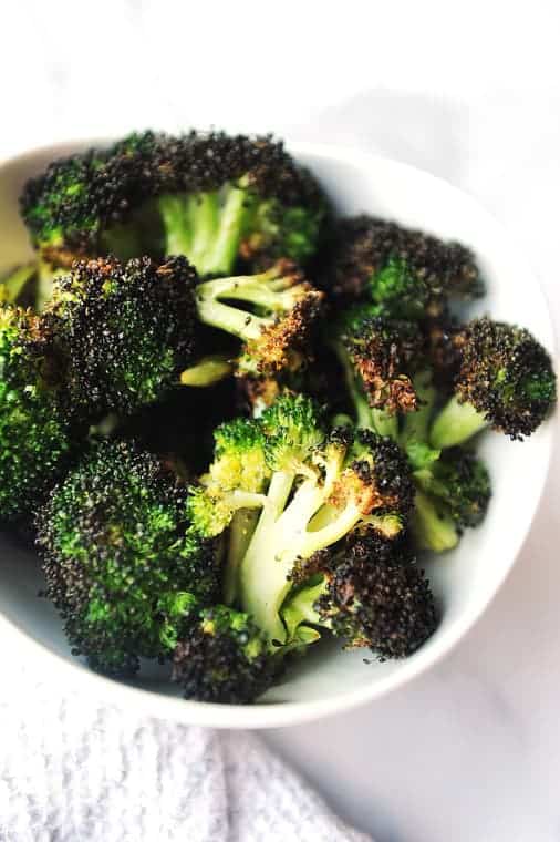 Air Fryer Broccoli is an easy to make healthy side dish.  Best crispy recipe for broccoli in the air fryer done in under 10 minutes!