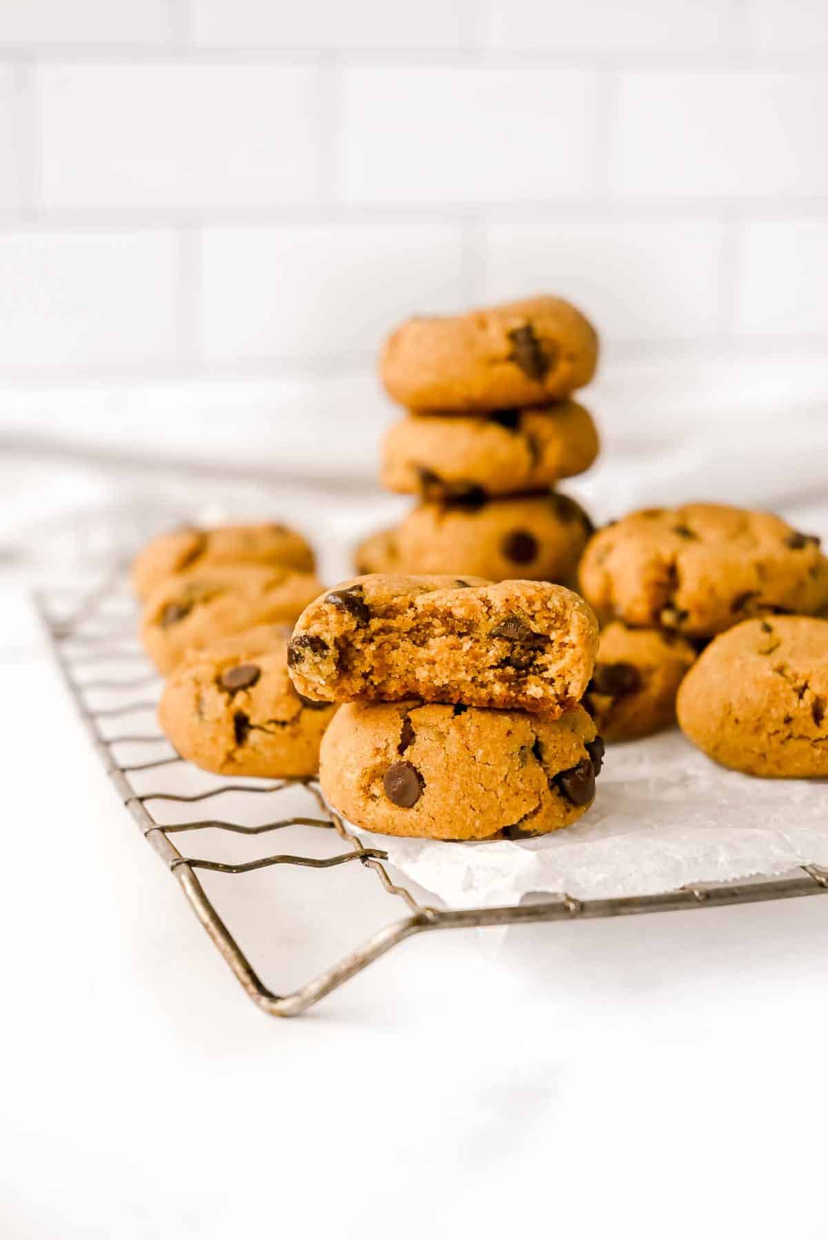 paleo chocolate chip cookies in a stack on a cooling rack