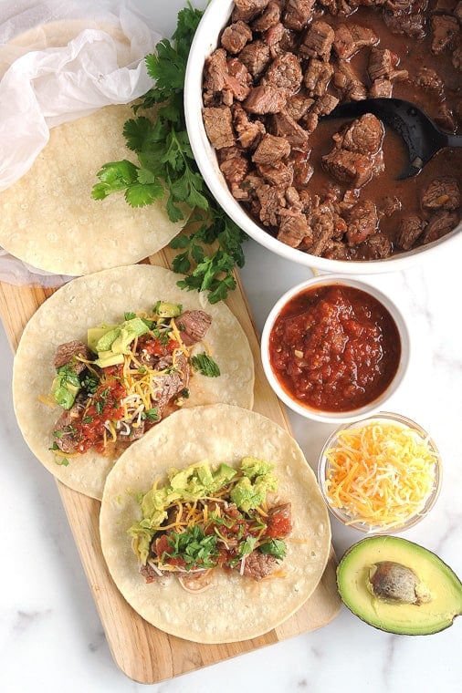 Instant Pot Carne Asada is easy and quick to make for delicious street tacos or instant pot steak nachos.  Just a few simple ingredients make this carne asada recipe Whole30 and Keto compliant.