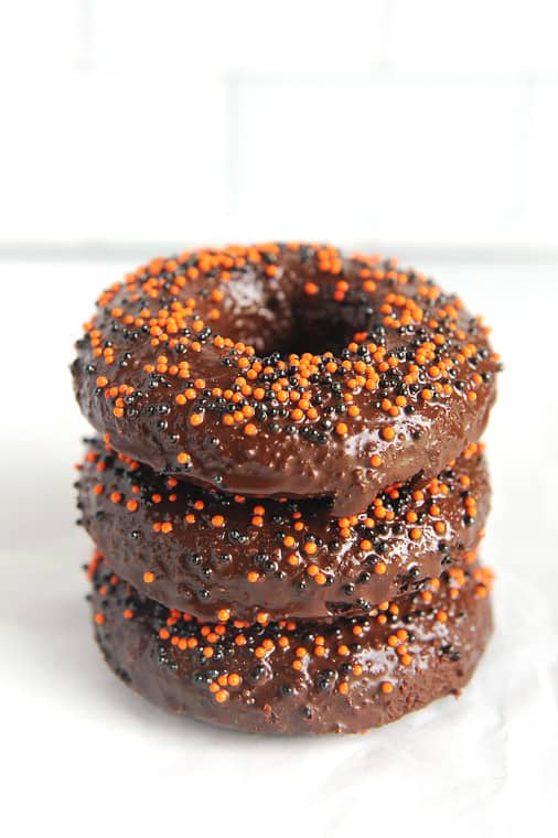 These chocolate cake donuts with no yeast are paleo donuts for any season!  Topped with glaze and sprinkles these keto chocolate donuts are just delicious!