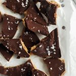 healthy chocolate almond butter bark recipe. tastes like a buckeye candy and is dairy free, gluten free, vegan and paleo. This healthy chocolate bark is easy to make for homemade christmas gifts or a healthy dessert idea all year round.