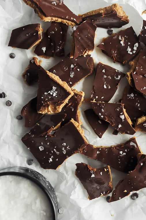 healthy chocolate almond butter bark recipe. tastes like a buckeye candy and is dairy free, gluten free, vegan and paleo. This healthy chocolate bark is easy to make for homemade christmas gifts or a healthy dessert idea all year round.