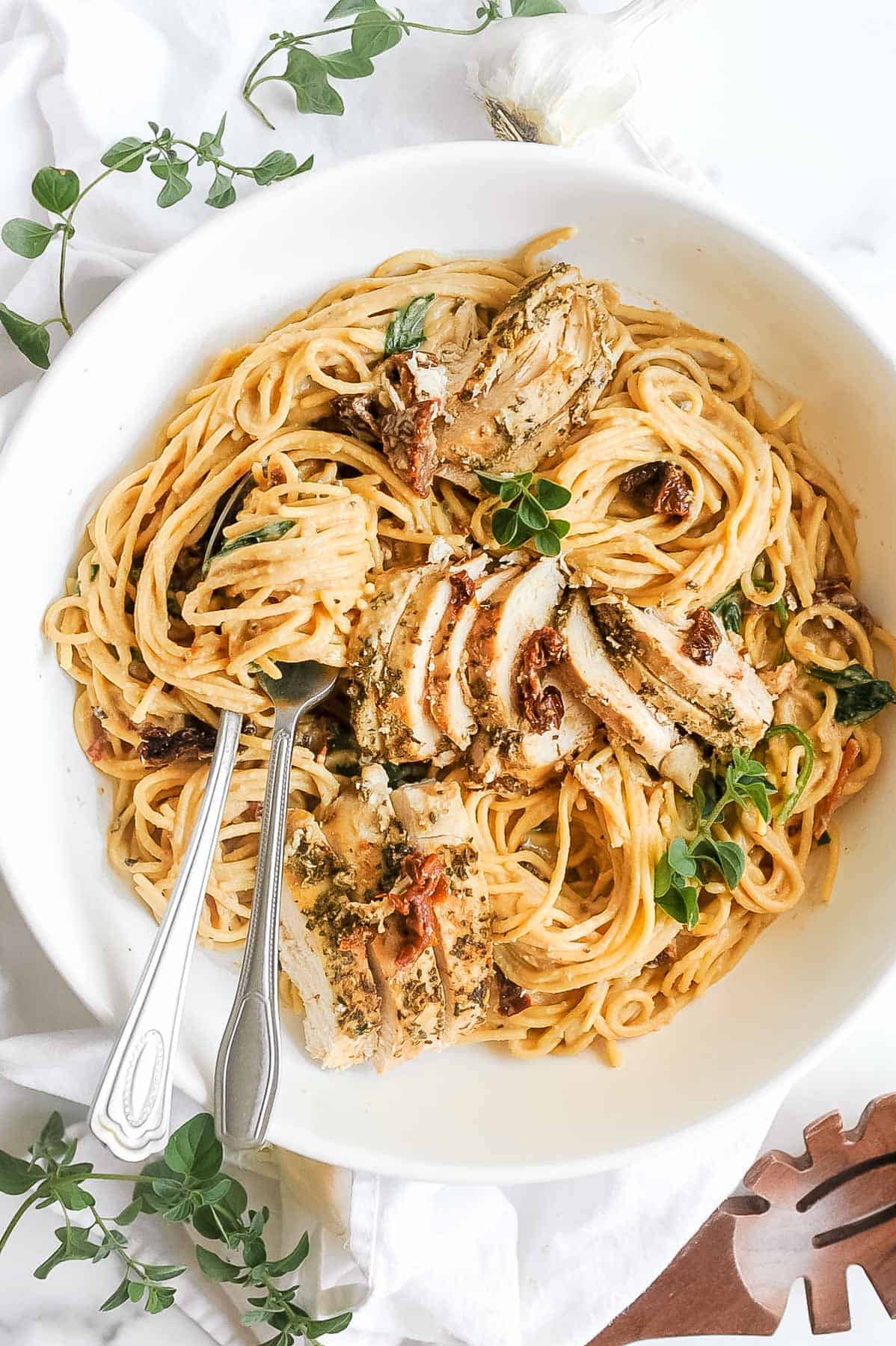 bowl of crock pot tuscan chicken with pasta