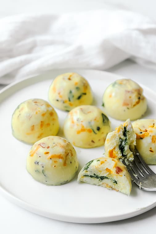 Instant Pot Egg Bites that are Keto, Whole30, Dairy Free and Gluten Free. Easy and healthy to make with bacon and spinach and better than Starbucks!
