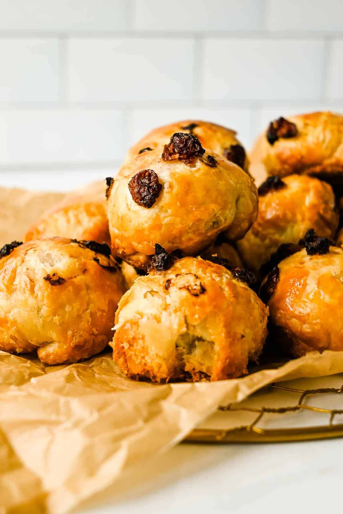 cranberry goat cheese puffs in a pile on parchment paper