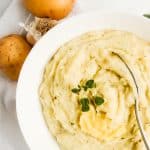 Whole30 Mashed Potatoes made with coconut milk and ghee are a delicious healthy mashed potato recipe. Momma Fit Lyndsey shares her easy whole30 potato recipe that is great as a healthy Thanksgiving side dish or complement to any Whole30 dinner recipe.