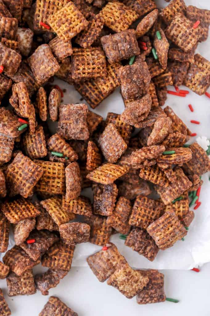 Healthy Chex Mix Muddy Buddies are a lightened up version of the original muddy buddies recipe you love! Made with Chex cereal, peanut butter powder and dairy free chocolate, skinny puppy chow is easy to make and so good!