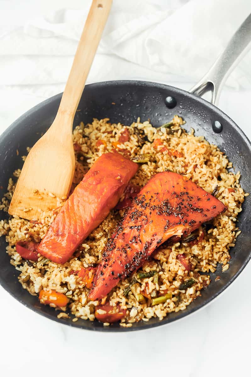 salmon in a skillet with rice