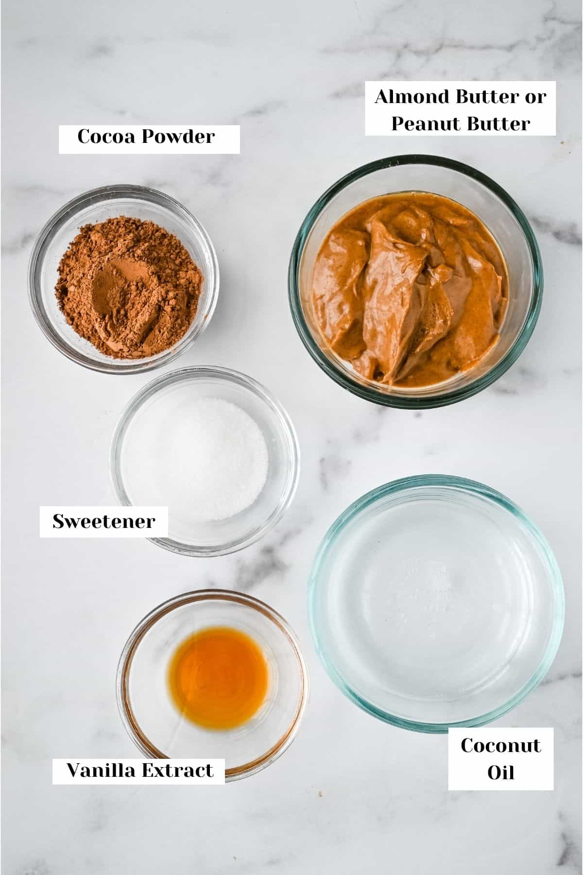 ingredients for this recipe for keto fat bombs on a white marble background.