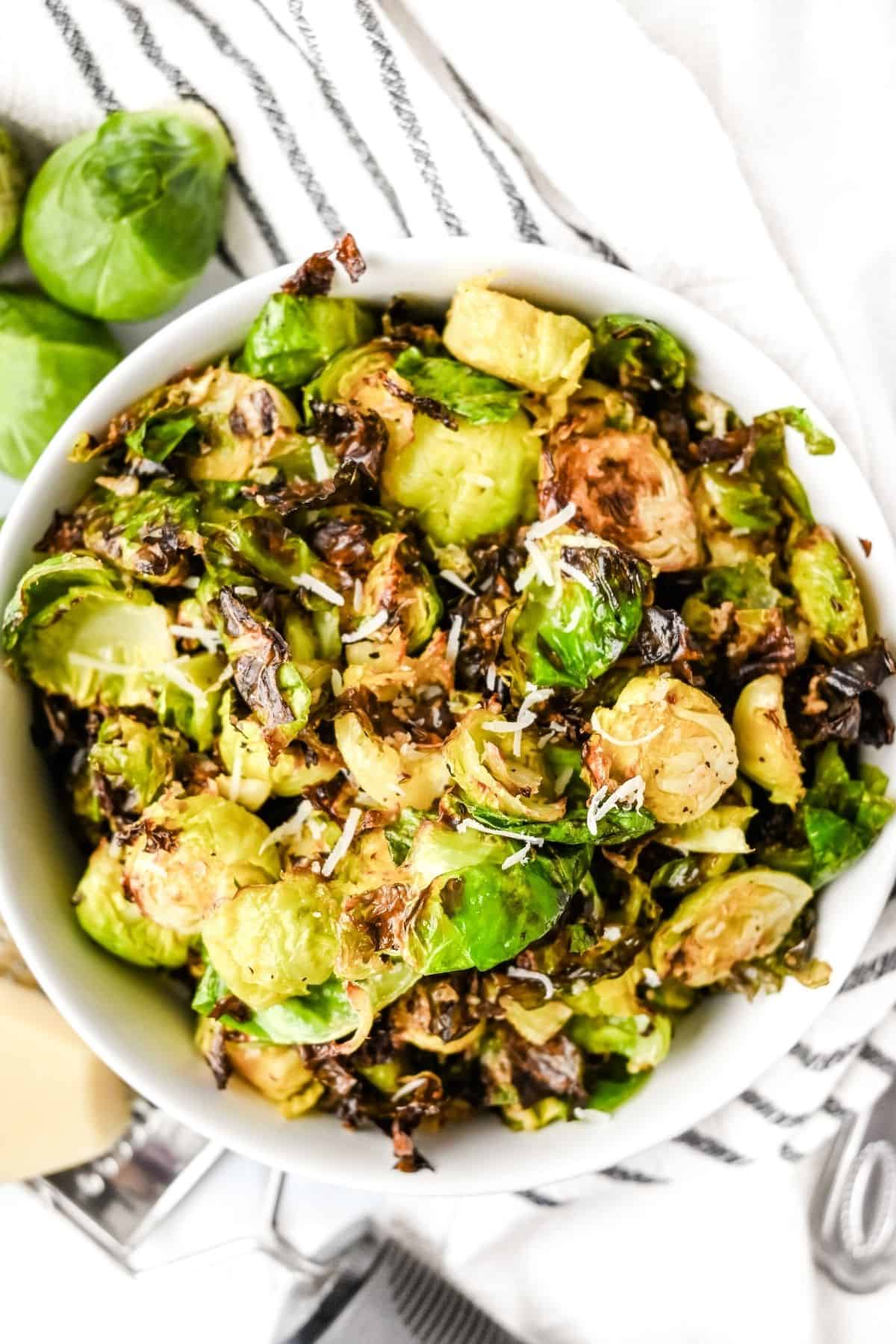 bowl of air fryer brussels sprouts with parmesan cheese