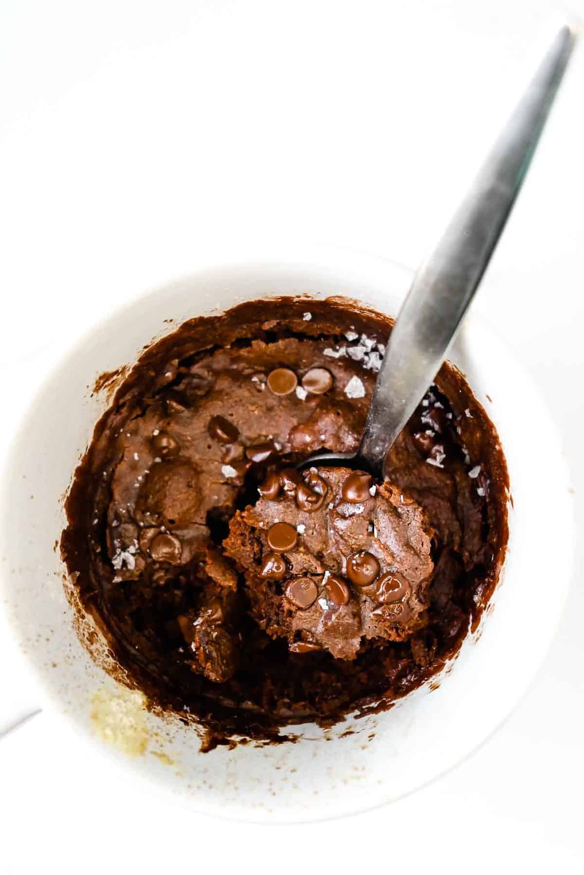 chocolate vegan brownie in a mug with a spoon