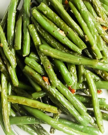 close up shot of blistered green beans.