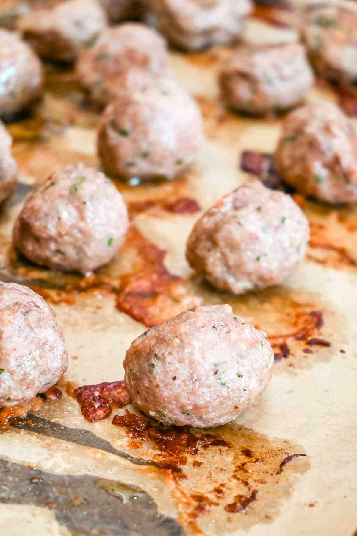 cooked eggless meatballs on parchment paper