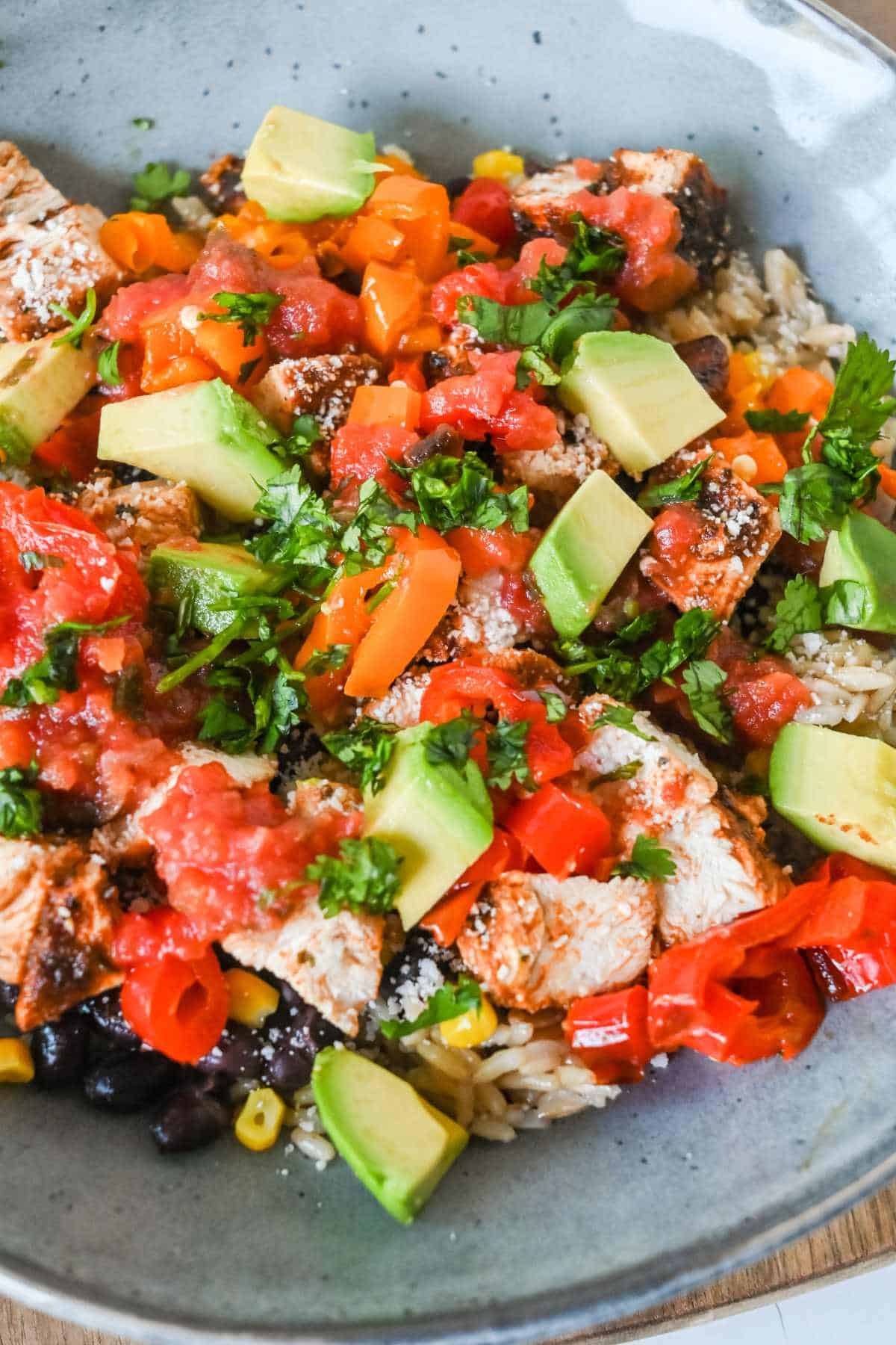 colorful southwest chicken bowl in a gray bowl.