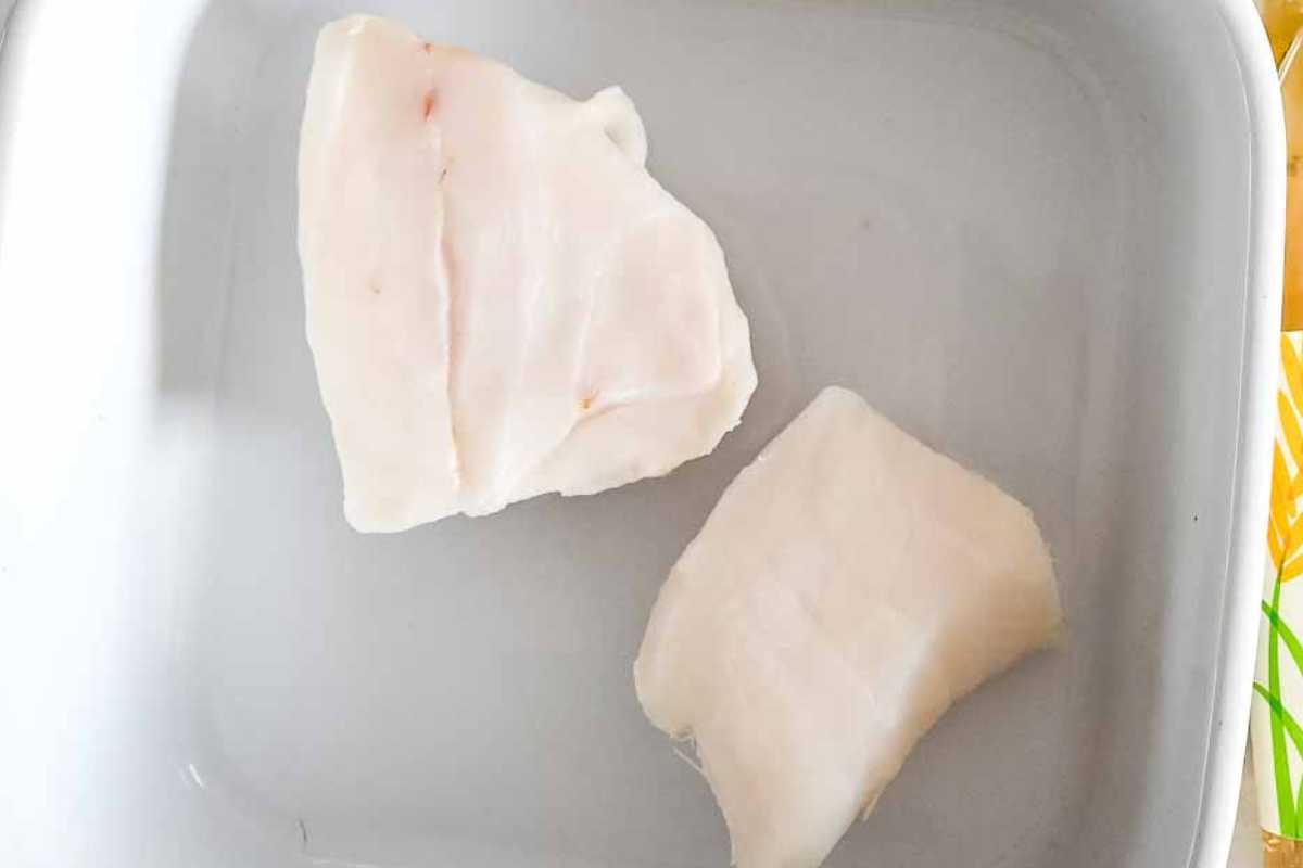 chilean sea bass in a white dish.