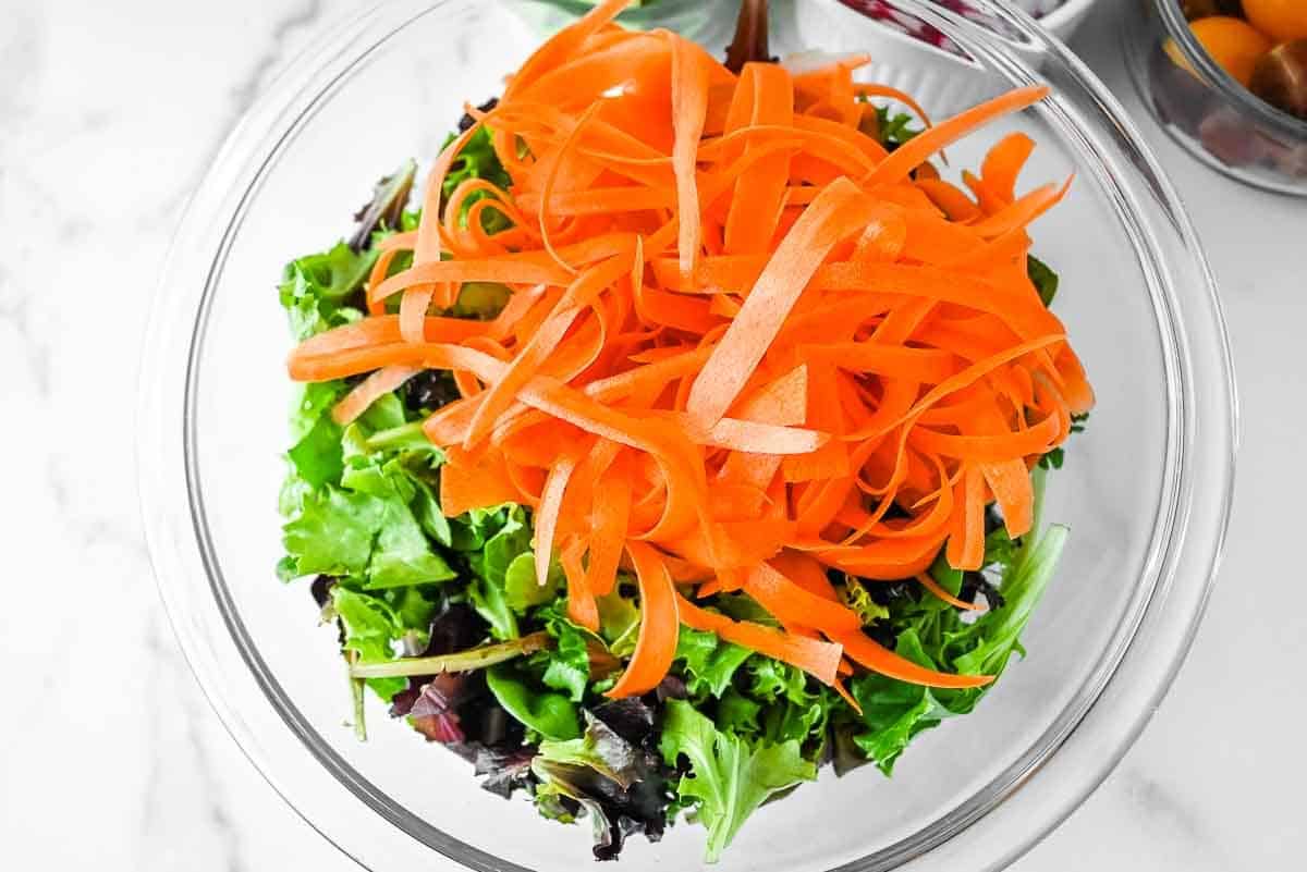 bowl of lettuce with carrots
