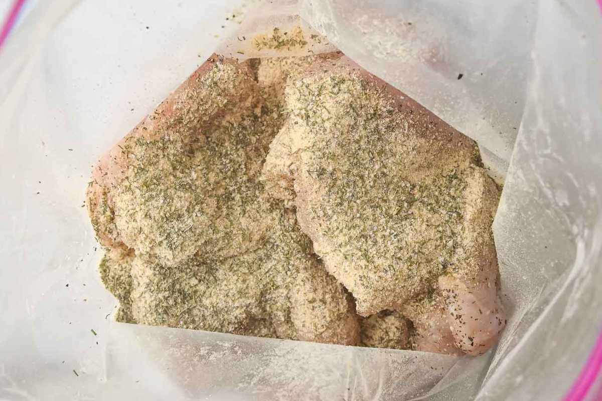 seasoned chicken breast in a ziploc bag.