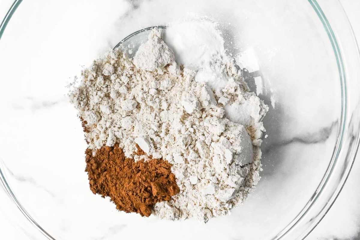 dry ingredients in a glass bowl on a white background.