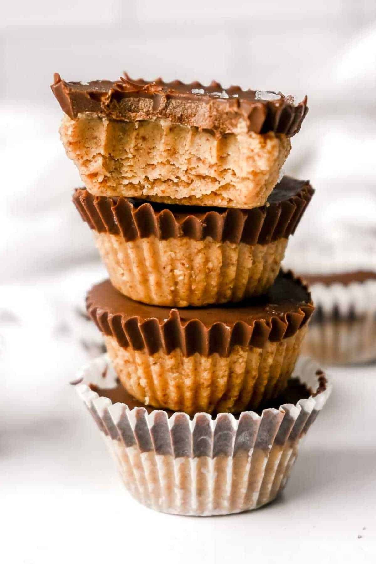 stack of healthy peanut butter cups with bite taken out.