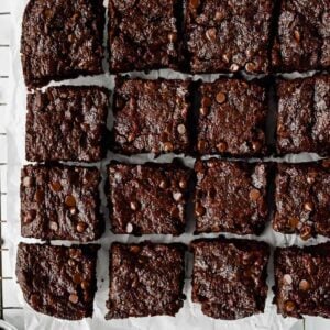 close up of eggless brownies on a cooling rack.
