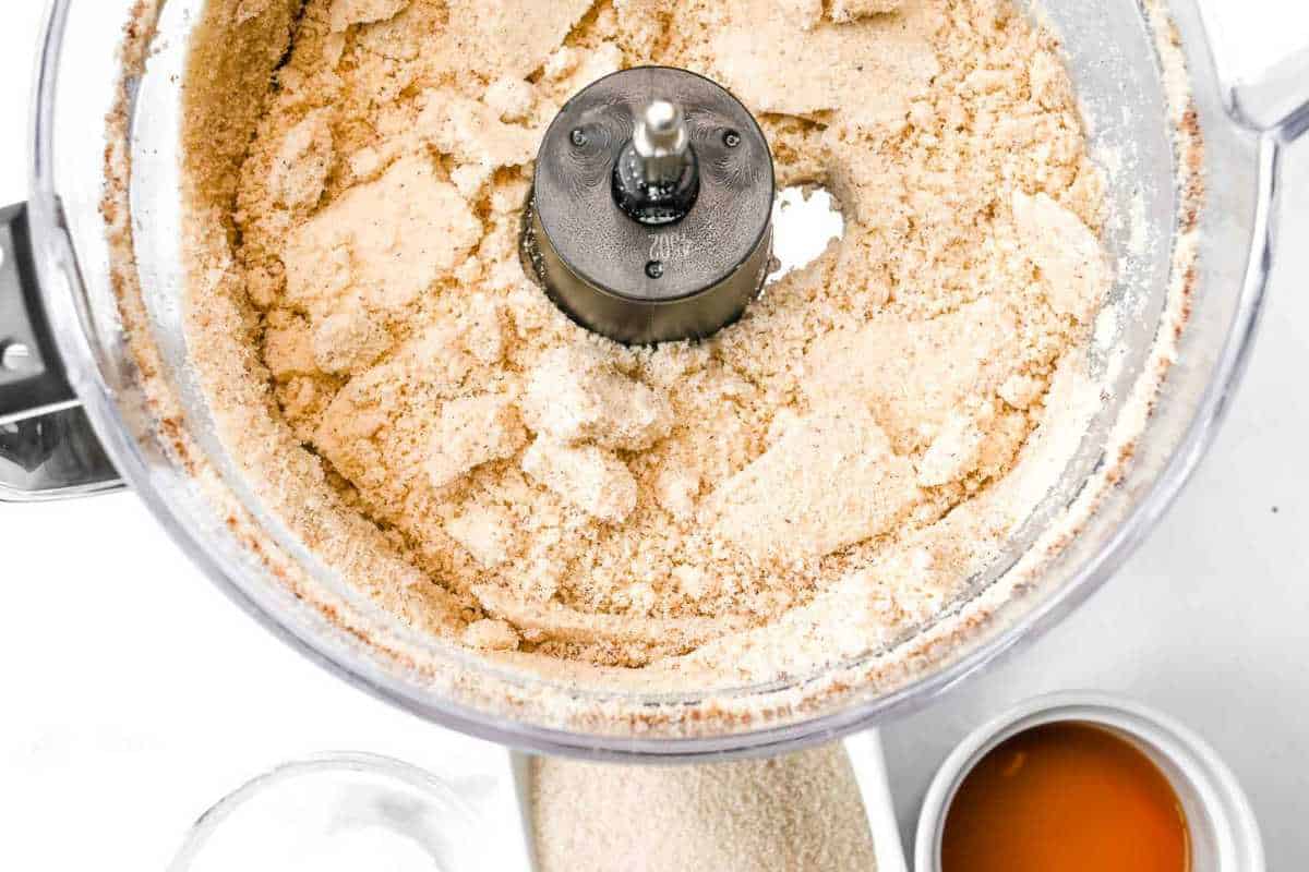 almond flour crust ingredients in a food processor.