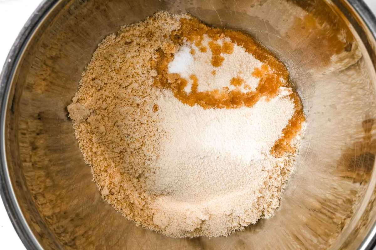 cheesecake crust ingredients in a silver bowl.