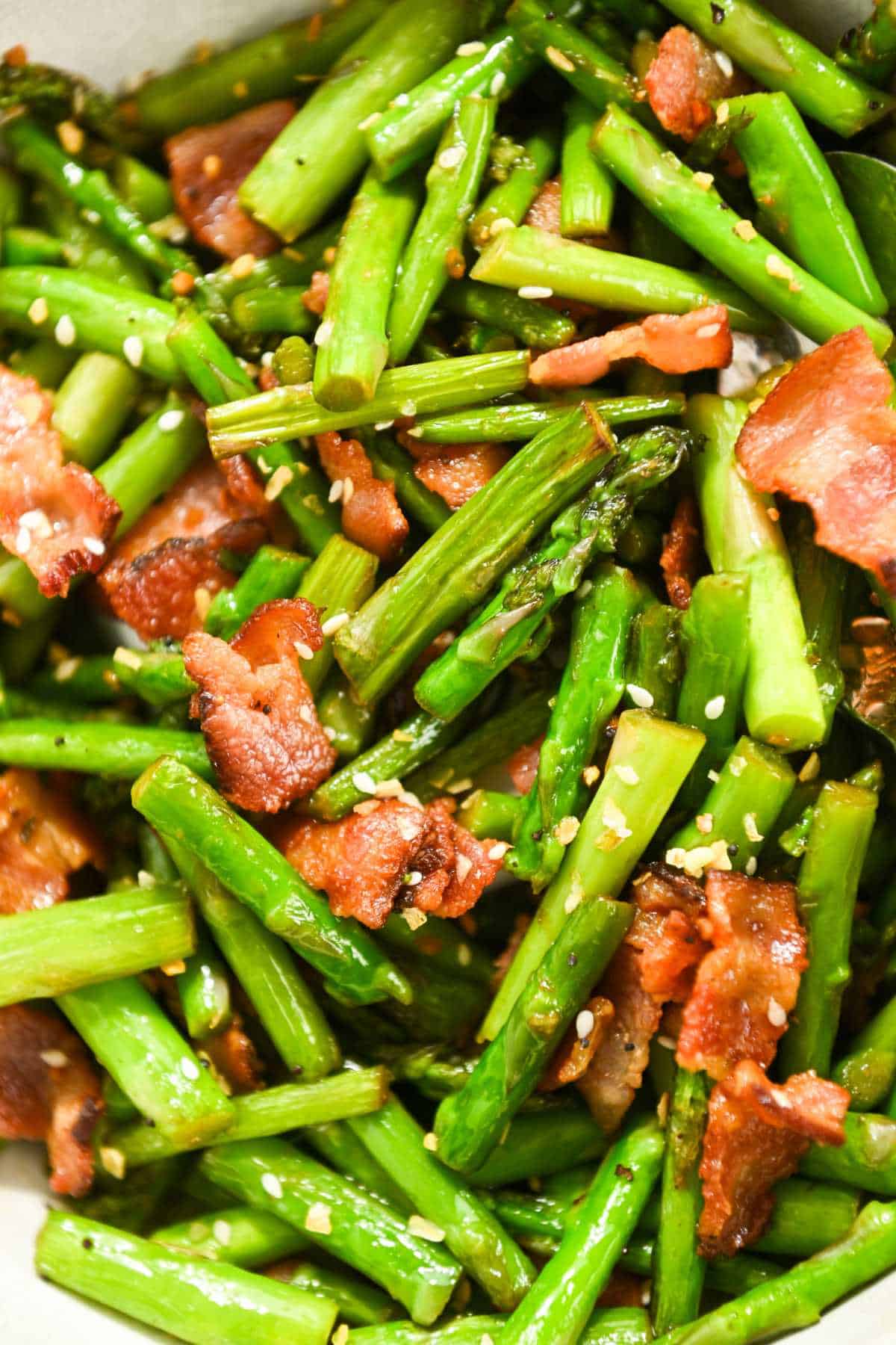close up of asparagus sauteed with bacon