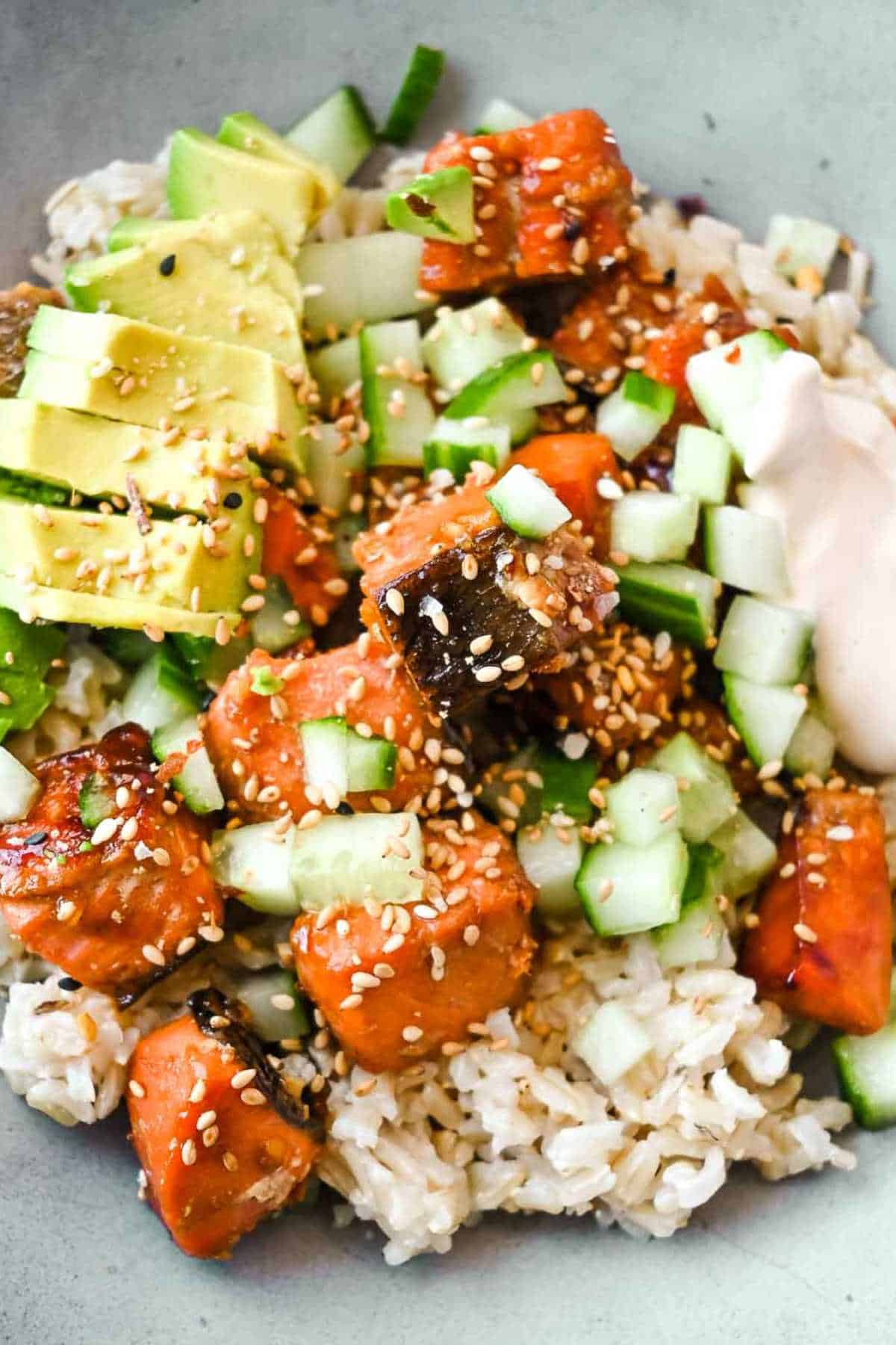 up close shot of cooked salmon bites in a poke bowl.