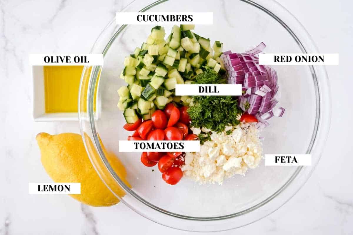labeled shot of cucumber salad ingredients on a white background.
