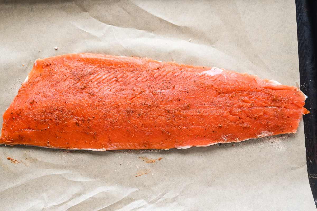 seasoned salmon on a sheet pan.