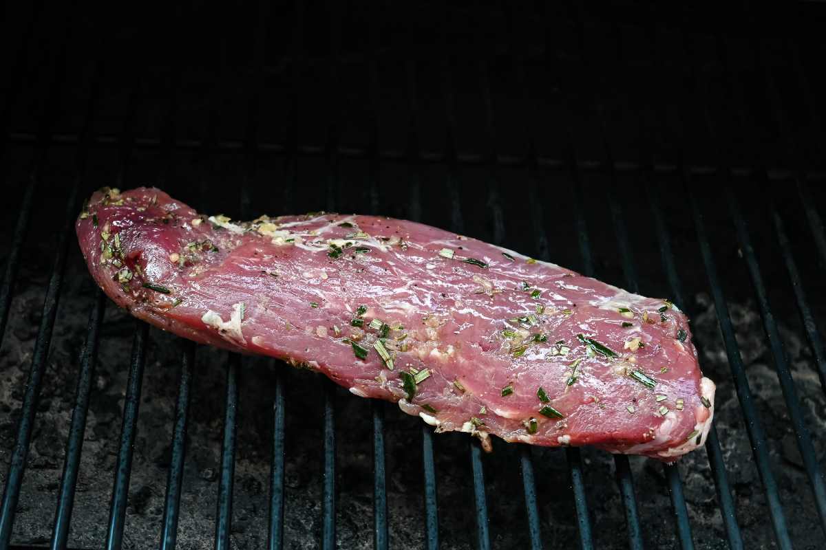 raw pork on a grill.