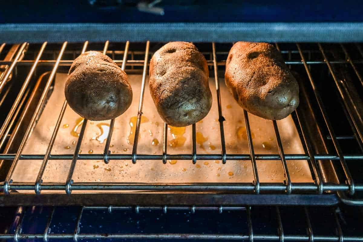baked potatoes in the oven on the rack.