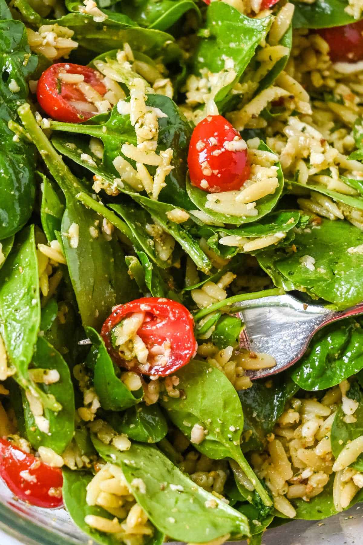close up of spinach and orzo salad.