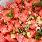 featured image close up of watermelon basil salad with cucumbers and feta.