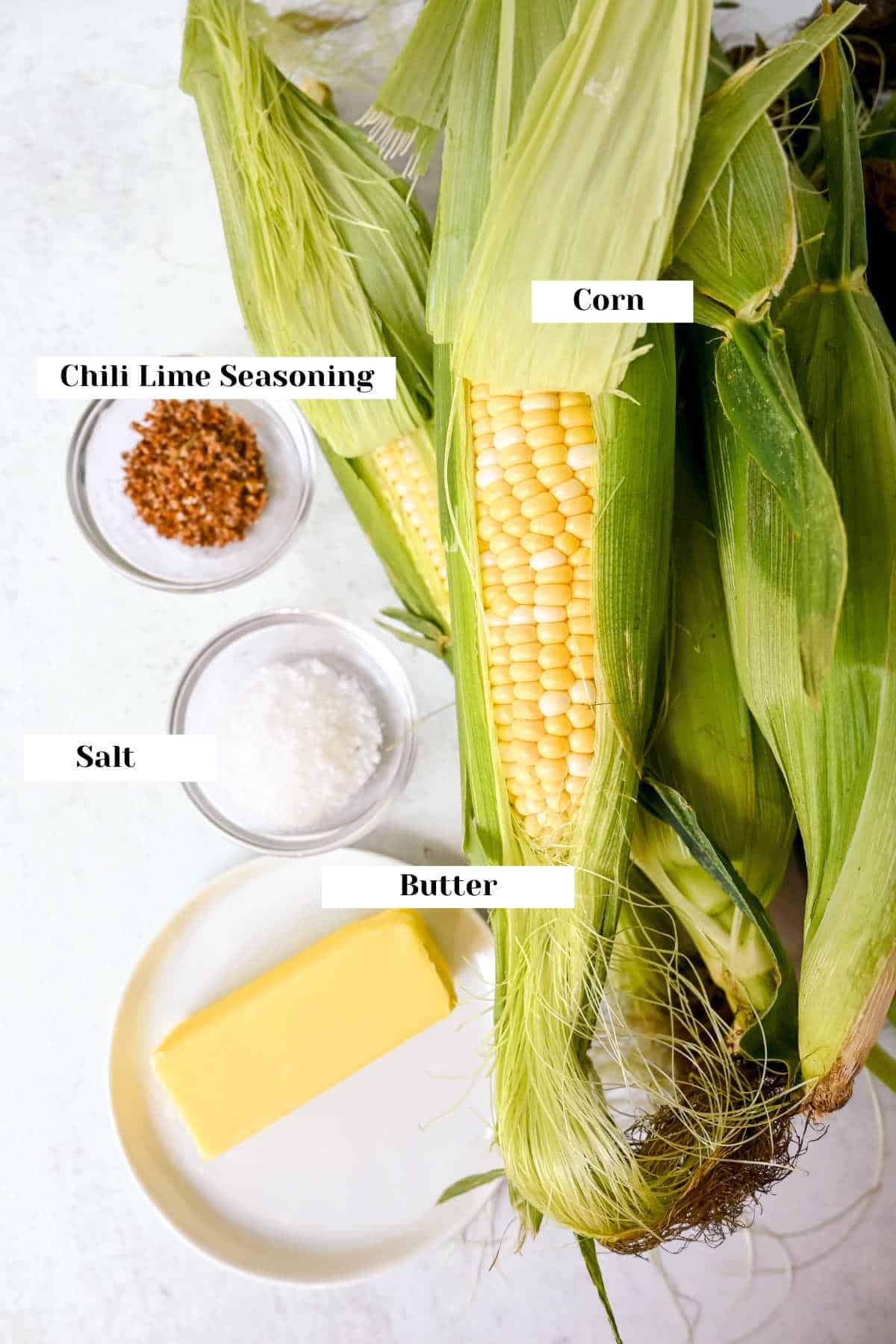 labeled ingredients for grilled corn on a white background.