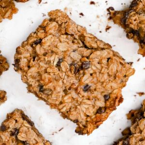 close up of 4-ingredient banana oatmeal bars on a white background.
