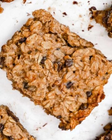 close up of 4-ingredient banana oatmeal bars on a white background.
