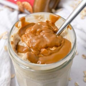 close up shot of overnight oats topped with Biscoff cookie butter.