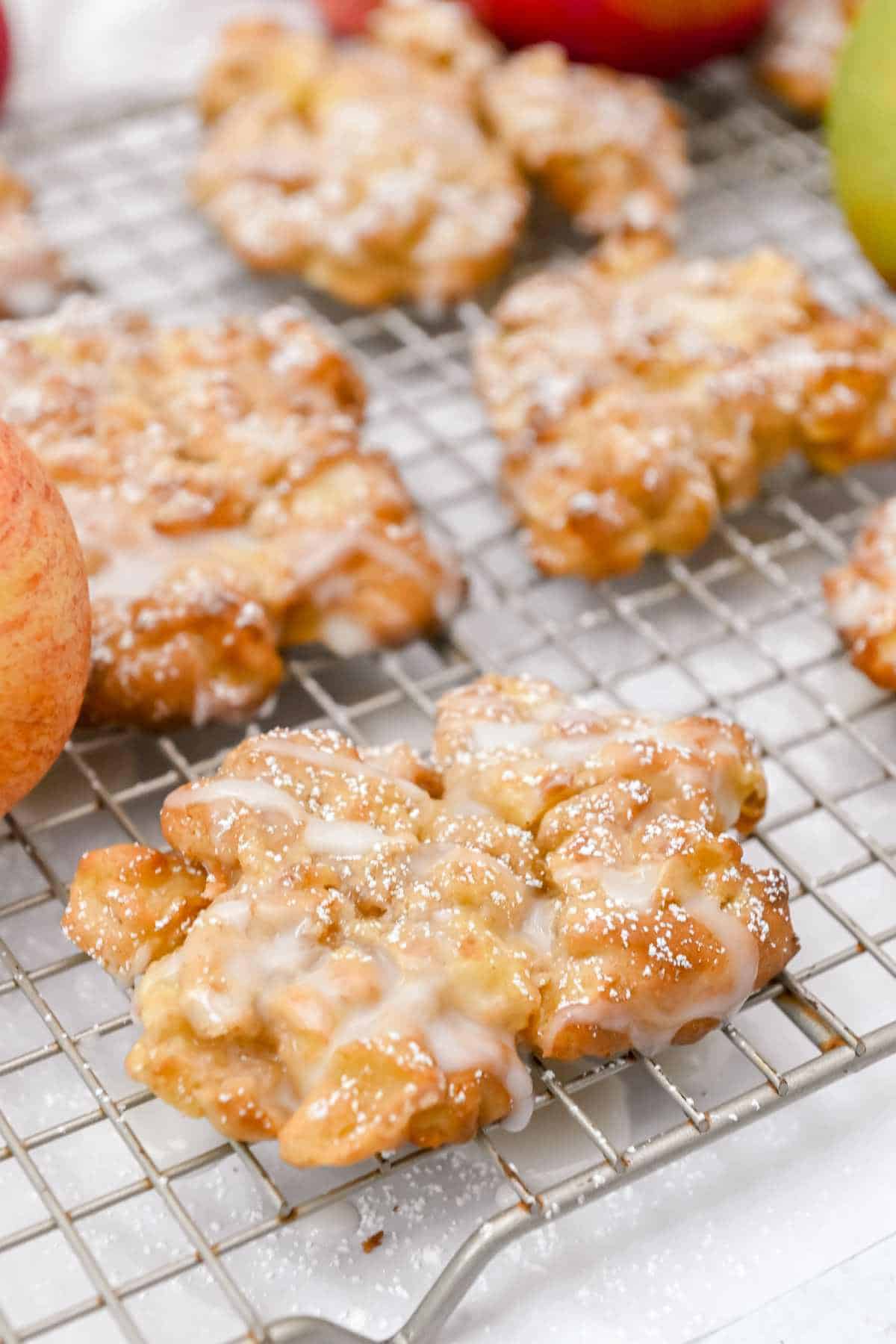 air fryer apple fritters on a baking rack.