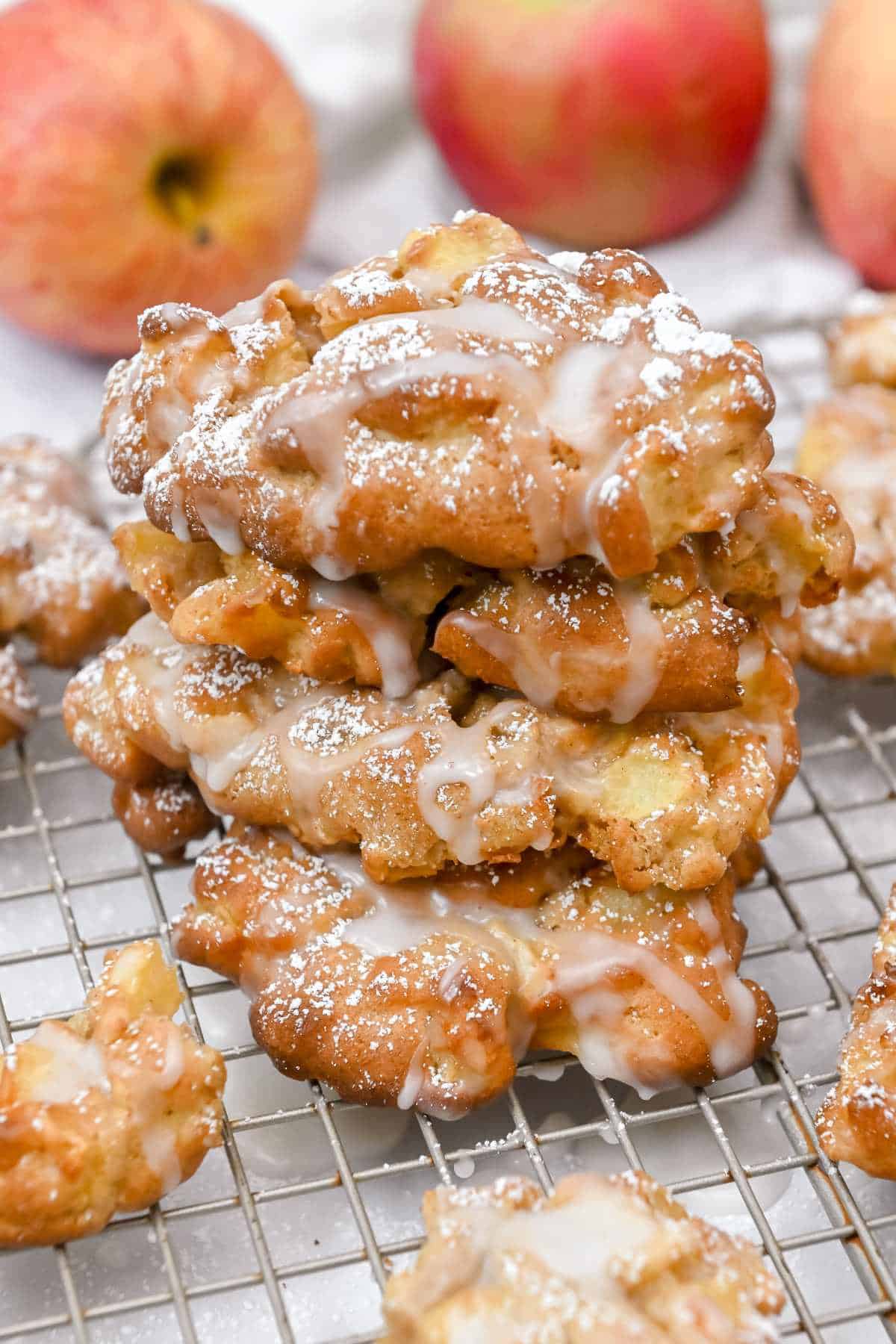 stack of air fryer apple fritters on a wire rack.