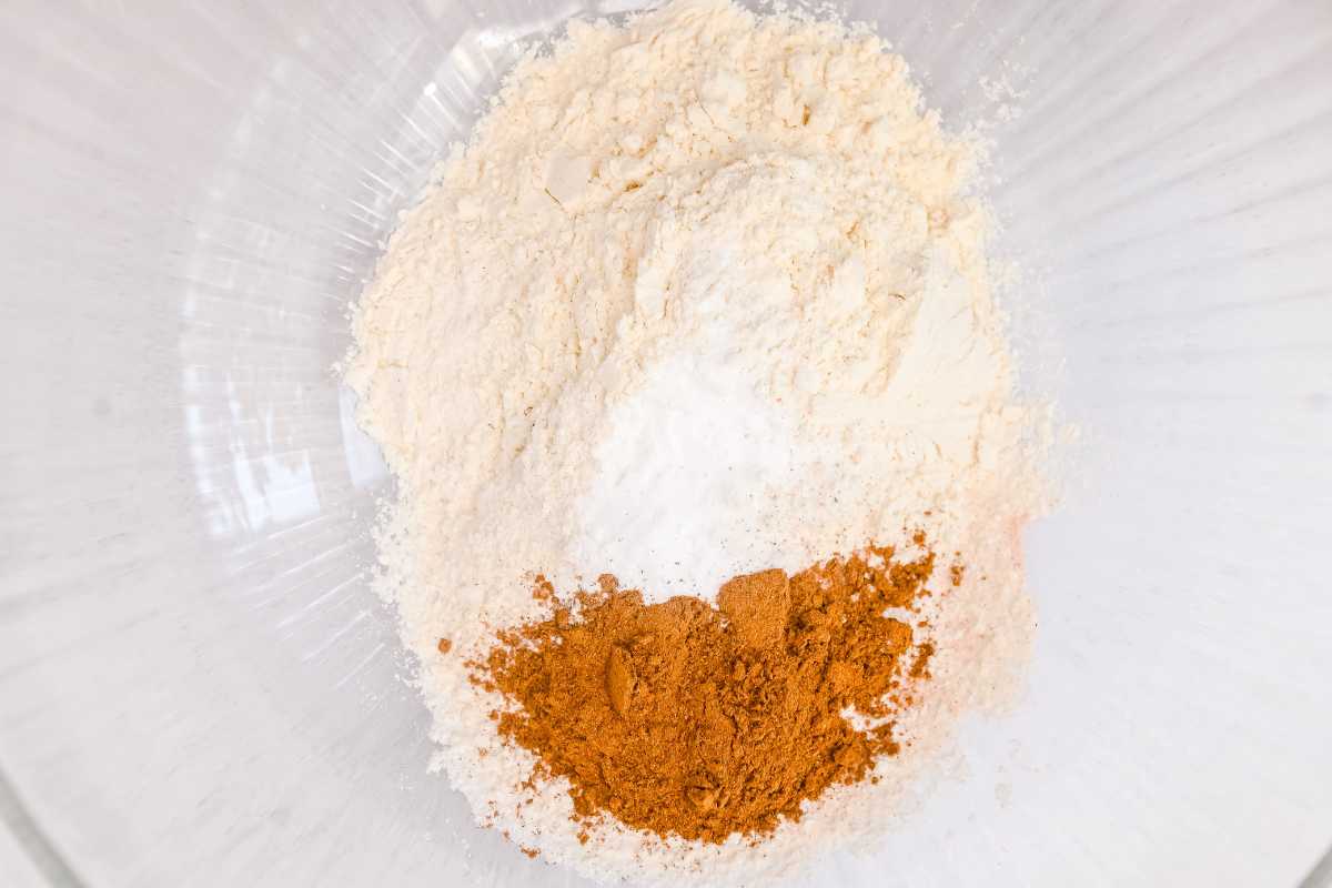dry ingredients in a glass bowl on a white background.