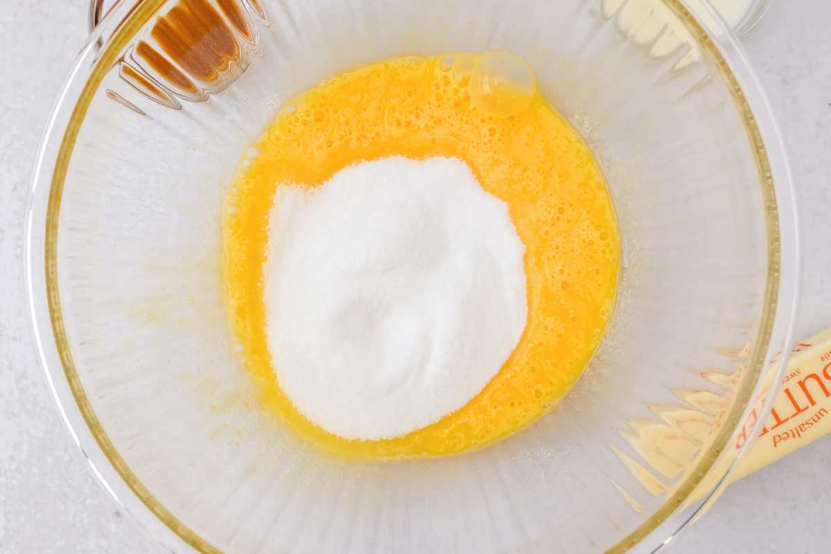 sugar and eggs in a glass bowl.